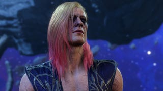A close-up of Bertie's character in Baldur's Gate 3. They are a white-skinned human male with long blond hair, dipped in pink at the bottom. They have black rings around their eyes and black veins are visible beneath their skin.
