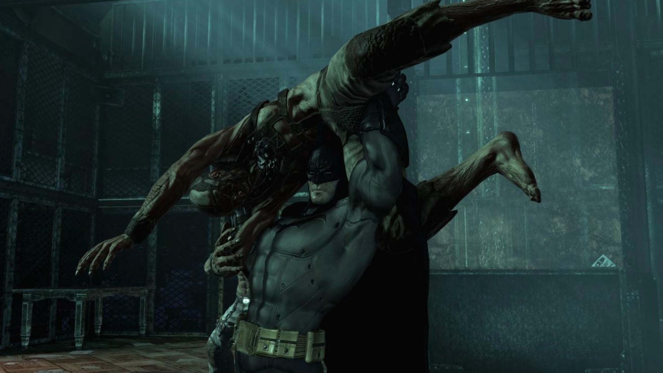 Batman lifting an enemy over his shoulders in Arkham Asylum.