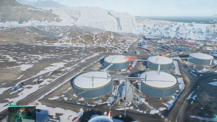 Nightbird helicopter hovers above oil tanks in Battlefield 2042.