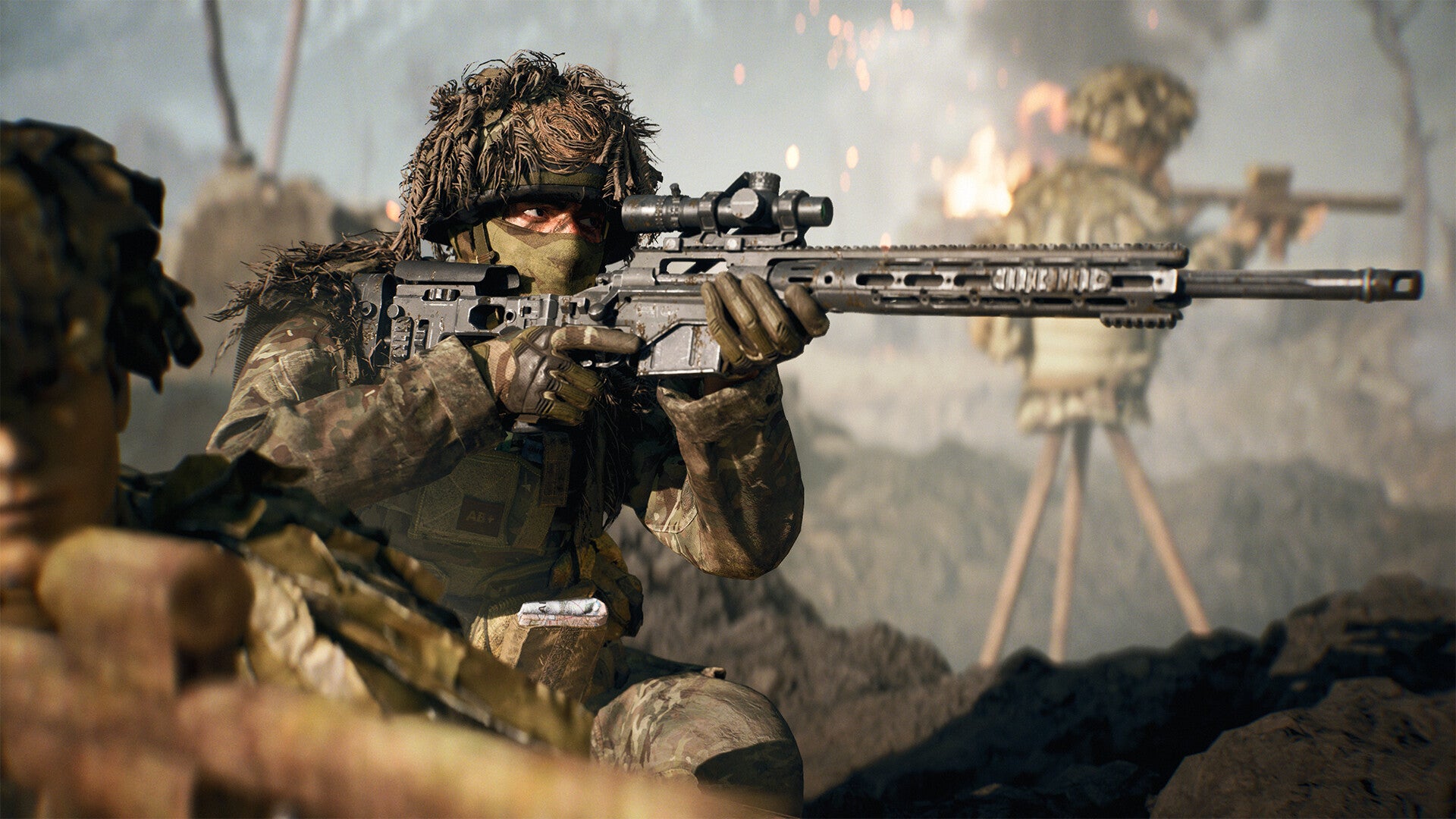 A Battlefield 6 worker successful a helmet and ghillie suit looks down the scope of a ample rifle, with a tiny detonation successful the background.