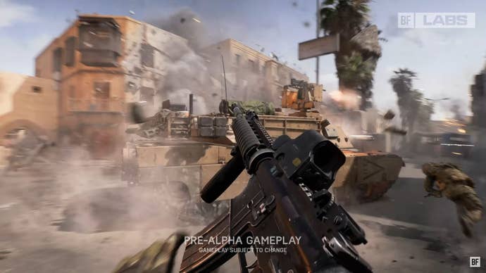 The player reloads their gun as a tank parks in the dusty street.
