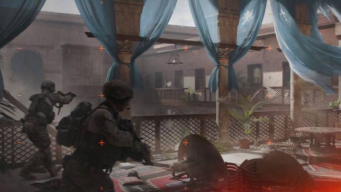 Two soldiers expanse a courtyard ruined by war.