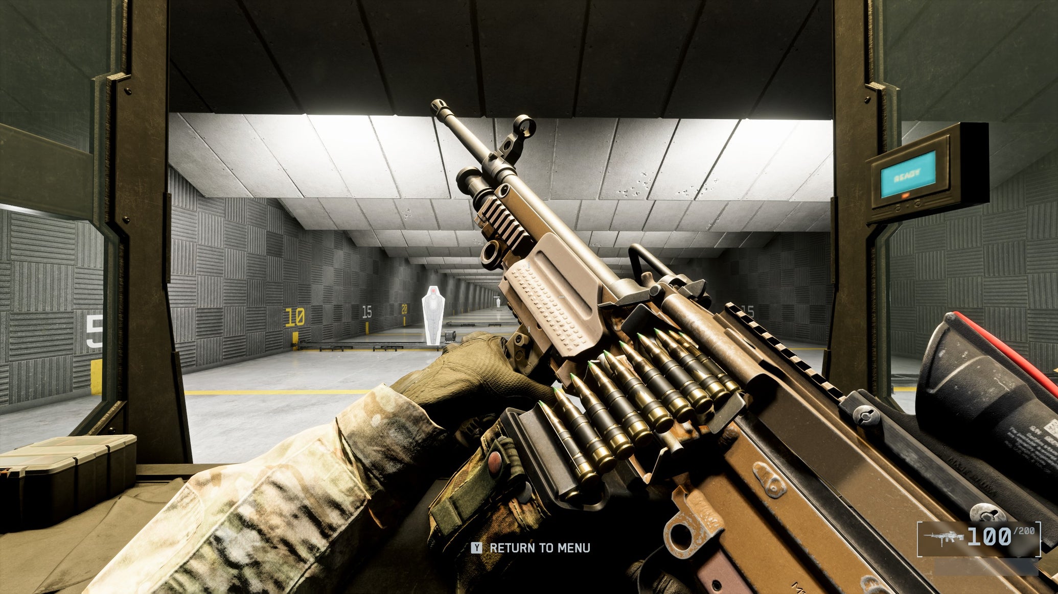 A close-up of the L110 LMG in Battlefield 6, with the gun tilted sideways by the player, angling towards the top left of the screen. In the background is a firing range. - 1