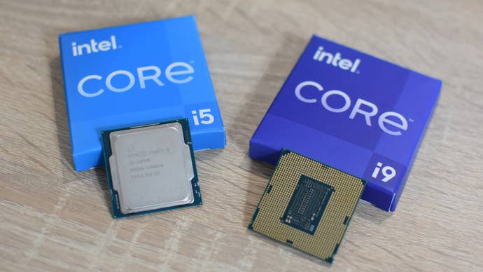 Several Intel Core CPUs placed next to some Intel packaging.