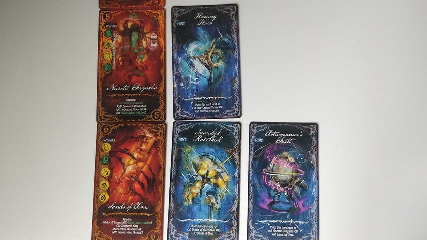 An image of item and curse cards from Betrayal: Deck of Lost Souls.