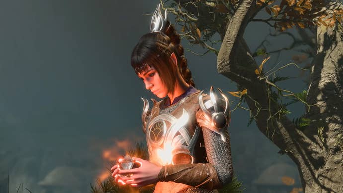 Shadowheart cradles a glowing orb in her hands in Baldur’s Gate 3