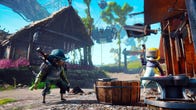 Biomutant - A player character cat in a blue, scaley cowboy hat and other assorted armor stands in a bright and colorful ramshackle town beside another cat character who wears a ushanka while hammering an anvil.