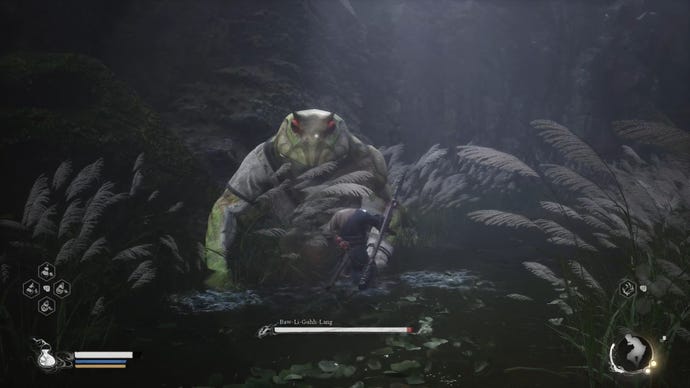The player in Black Myth: Wukong fights against Baw-Li-Guhh-Lang, a giant frog boss in a river.