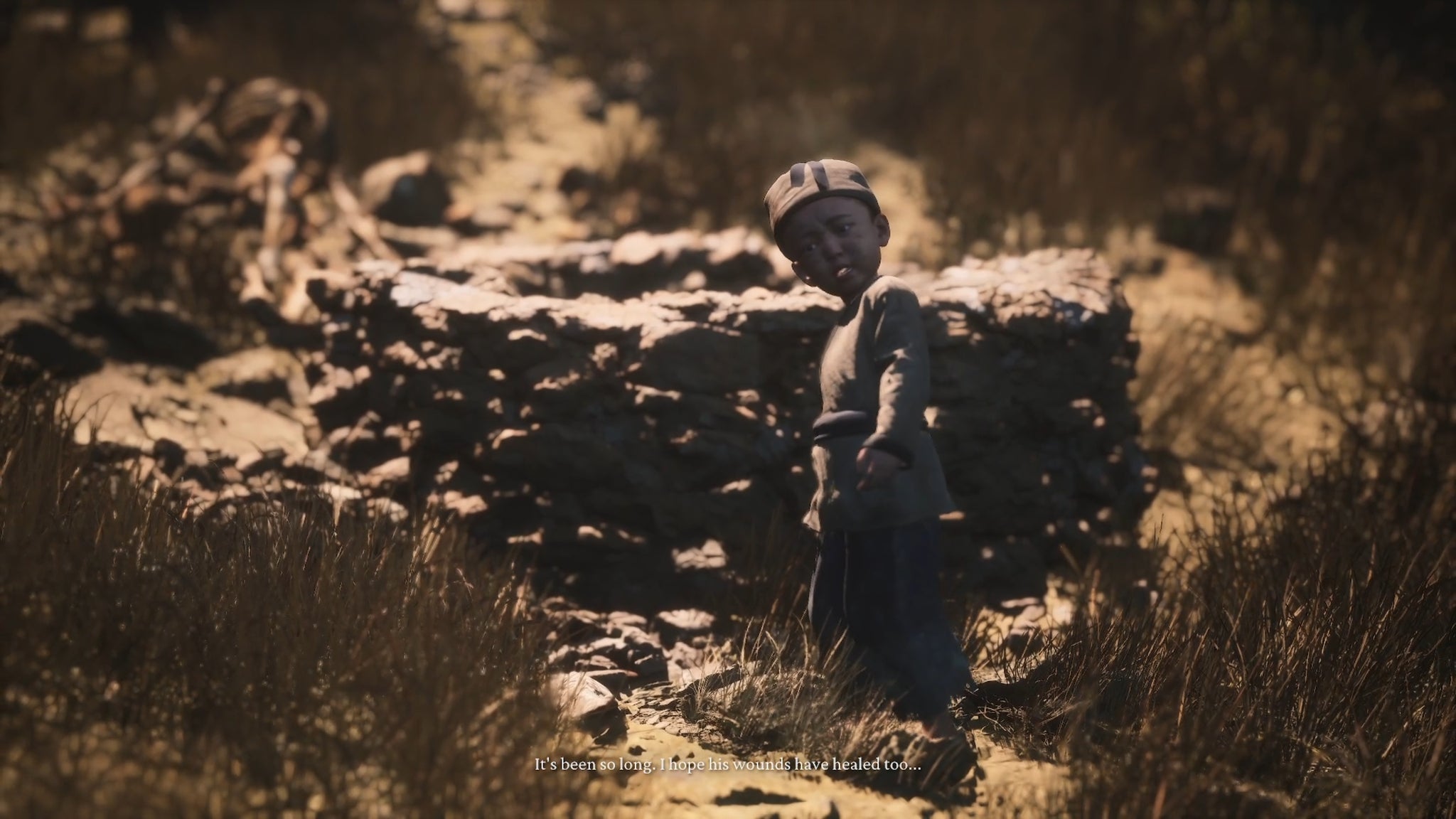 A spirit of a child in Black Myth: Wukong stands next to a wall and looks at the camera. - 17