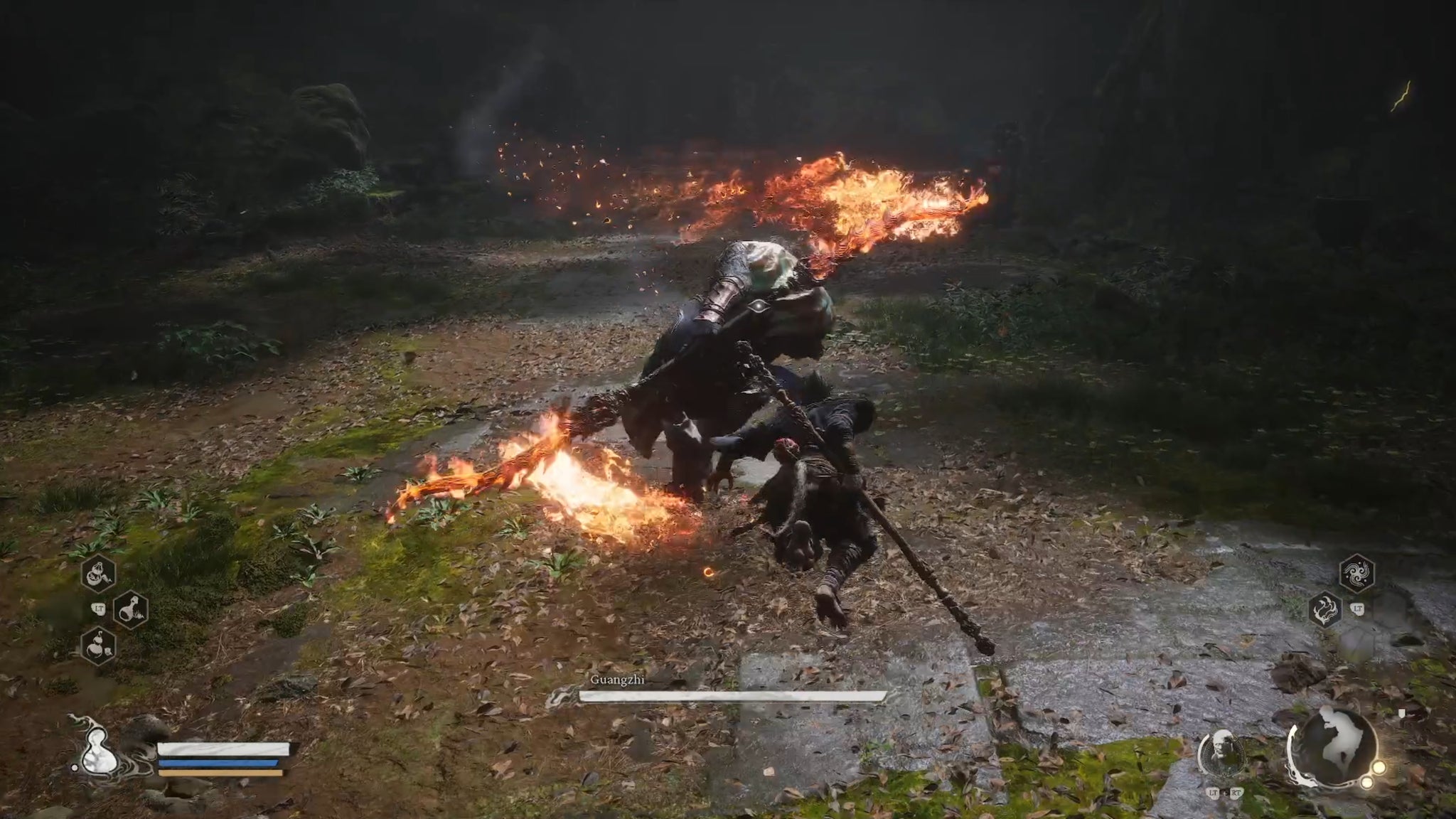 The player in Black Myth: Wukong fights Guangzhi, an enemy wielding a flaming double-edged sword. - 7