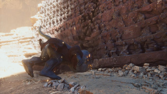 A screenshot of the player in Black Myth: Wukong taking the form of the Wandering Wight in order to headbutt a wall in Chapter 2, cracking it open to reveal a secret area.