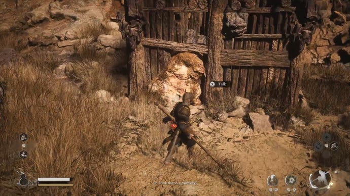 The player in Black Myth: Wukong speaks to the Hiding Rat Captain inside a hovel in Sandgate Village, near the start of Chapter 2.