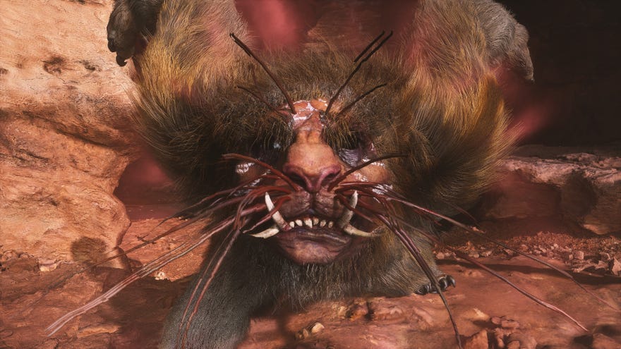 A close-up of the Mad Tiger boss’s face as it roars towards the camera outside its cave in Chapter 2 of Black Myth: Wukong.