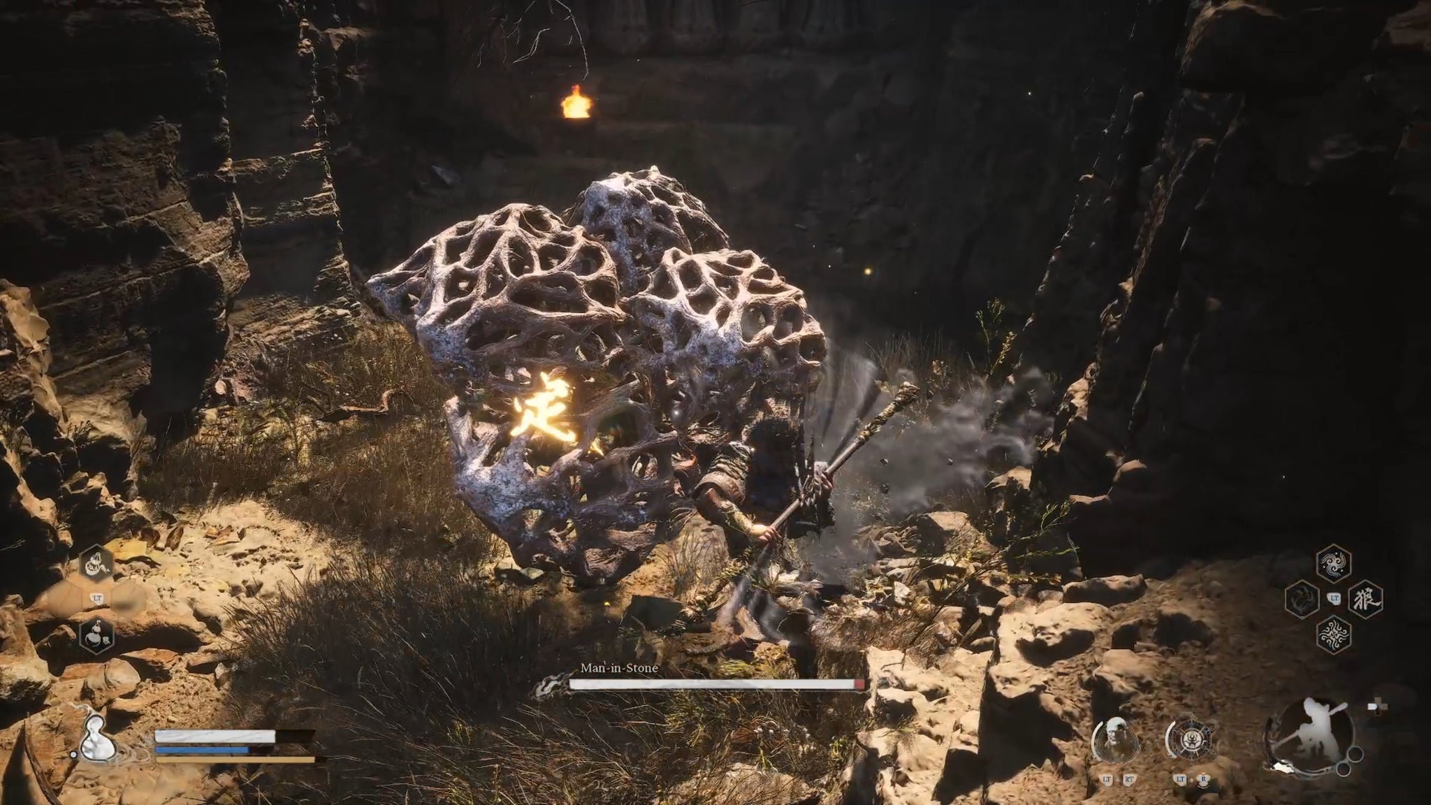 The player in Black Myth: Wukong fights the Man-In-Stone NPC. - 14