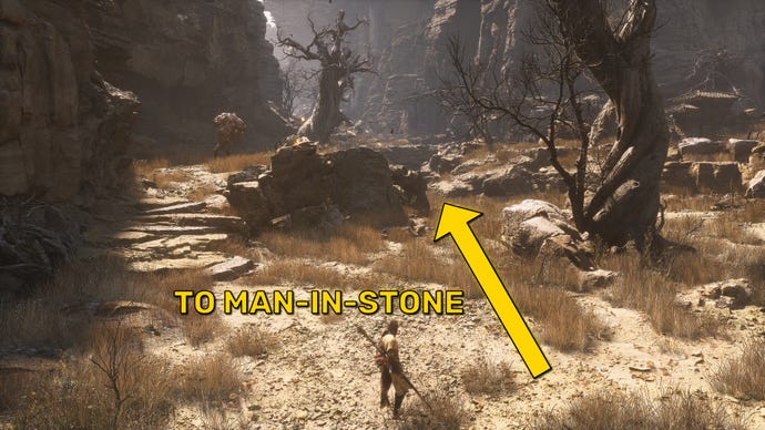 A screenshot of the landscape near the Squall Hideout Keeper’s Shrine in Black Myth: Wukong, with an arrow pointing towards the location of the Man-In-Stone.