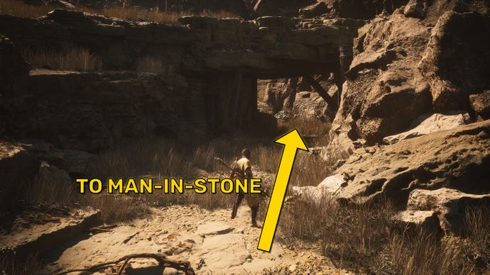 A screenshot of the landscape near the Squall Hideout Keeper’s Shrine in Black Myth: Wukong, with an arrow pointing towards the location of the Man-In-Stone.