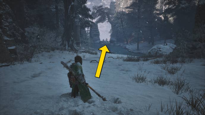 The player in Black Myth: Wukong runs along a path towards the secret Melon Field area in the snow-covered Valley Of Ecstasy.