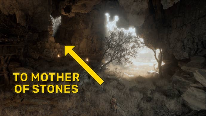 A screenshot of the cave interior in the Fright Cliffs of Black Myth Wukong, with the path to the Mother Of Stones marked with a yellow arrow.