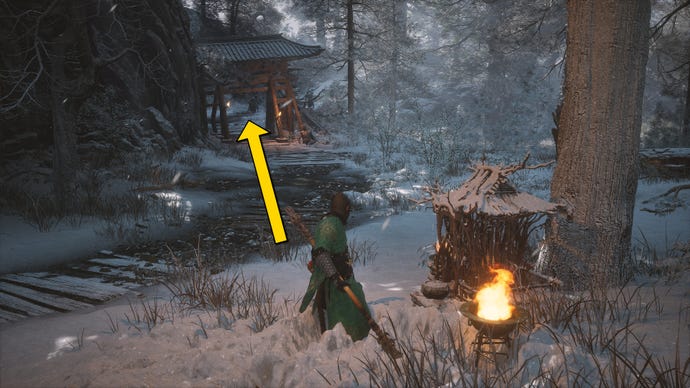 The player in Black Myth: Wukong runs along a path towards the Old Ginseng Guai boss in the snow-covered Valley Of Ecstasy.