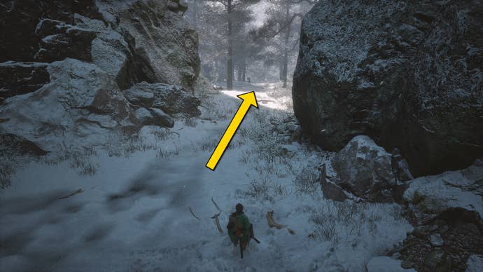 The player in Black Myth: Wukong runs along a path towards the Old Ginseng Guai boss in the snow-covered Valley Of Ecstasy.