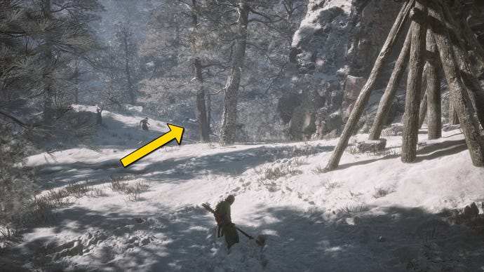 The player in Black Myth: Wukong runs along a path towards the Old Ginseng Guai boss in the snow-covered Valley Of Ecstasy.