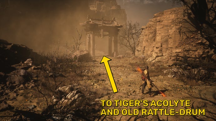 The player in Black Myth: Wukong stands in front of a large arched bridge in the Yellow Wind Formation region of Chapter 2.