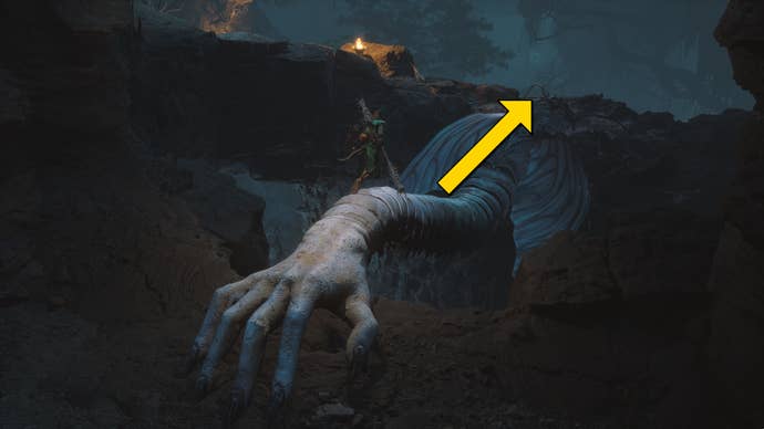 The player in Black Myth: Wukong heads along the path to the Yellow Loong boss in Chapter 4, while yellow arrows point the way down the path.