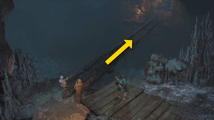 The player in Black Myth: Wukong heads along the path to the Yellow Loong boss in Chapter 4, while yellow arrows point the way down the path.