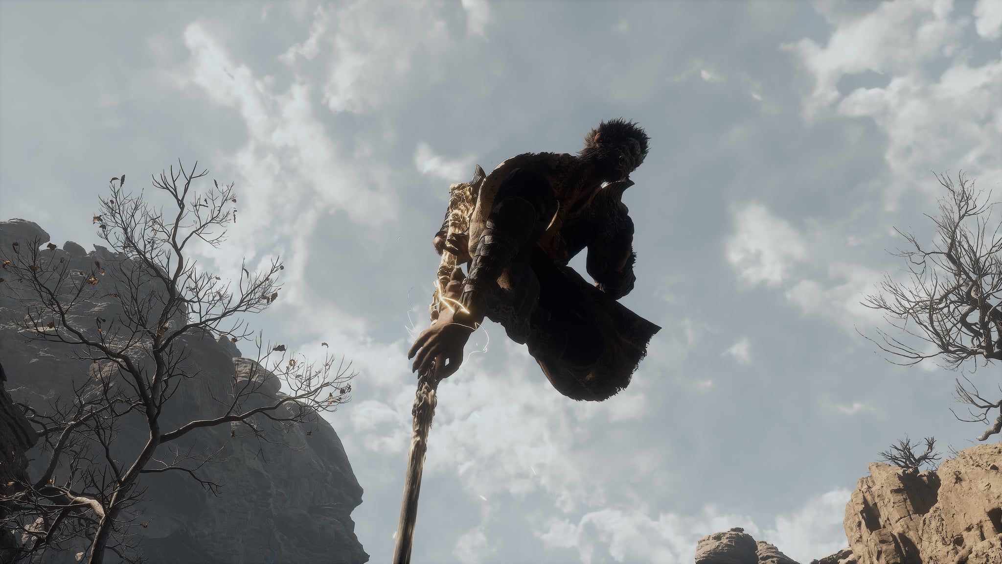 The player in Black Myth: Wukong uses Pillar Stance to hoist themselves into the air with their staff. - 6