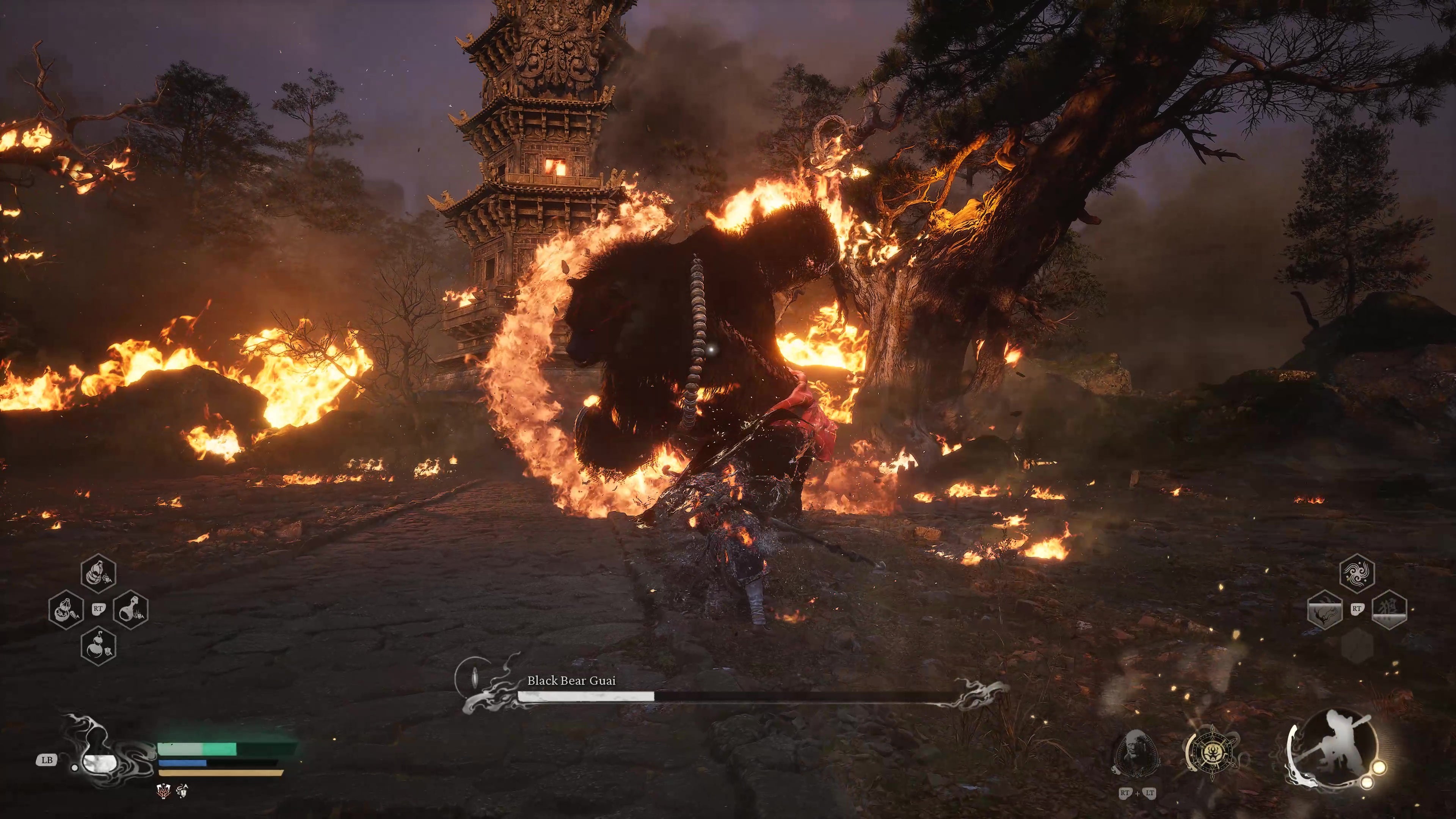 A monkey warrior activates a fireproof mantle against a flaming bear in Black Myth Wukong.