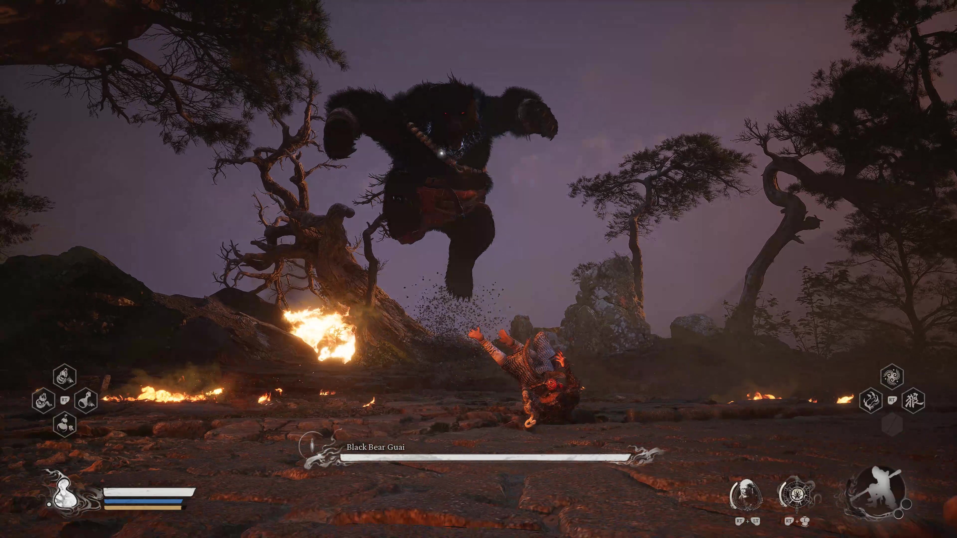 A monkey warrior fights a large bear leaping through the air in Black Myth Wukong.
