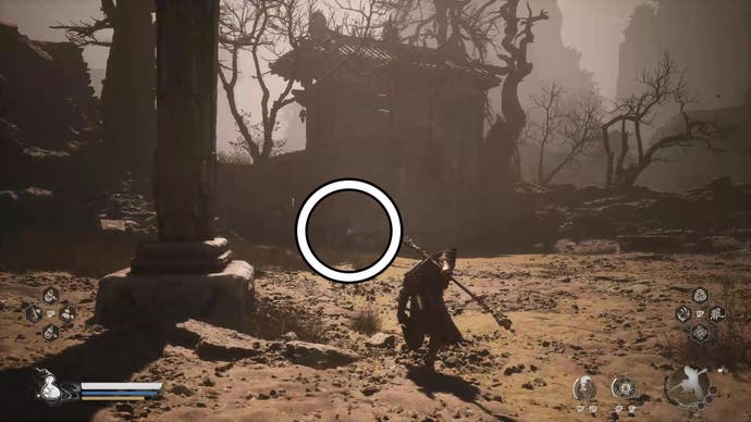 A monkey warrior approaches a large gate in a desert in Black Myth Wukong