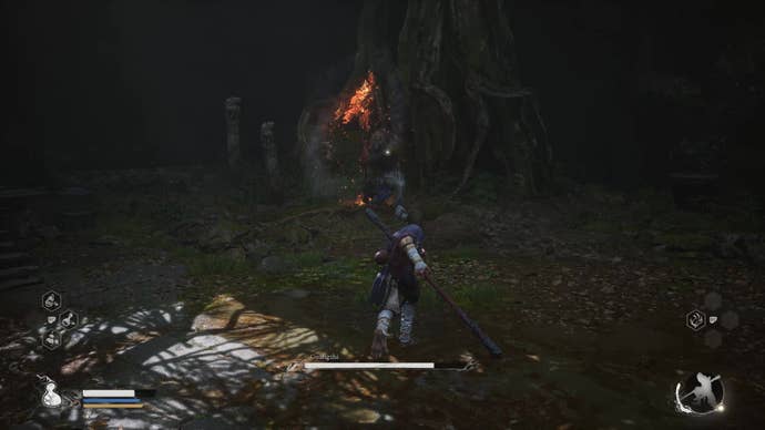 A monkey warrior prepares to dodge an attack from a spear-wielding wolf in Black Myth Wukong.