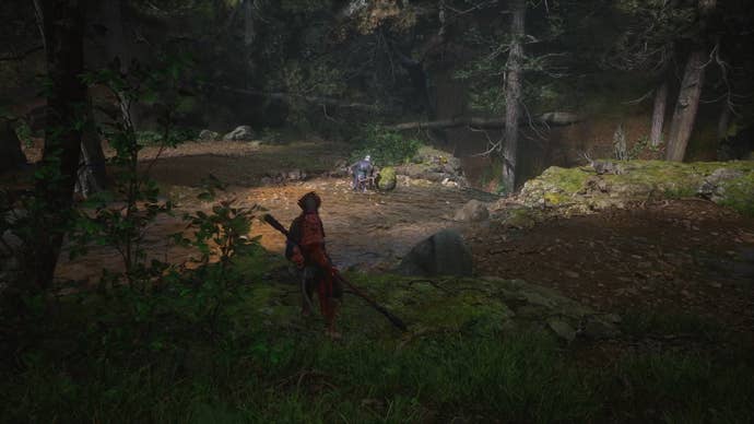 The player in Black Myth: Wukong approaches a Buddha head statue on the ground in Chapter 1, where a monkey is seen briefly before running away.