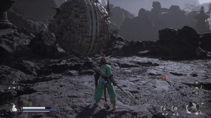 The player stands in front of a giant spiked metal sphere guarding the Ashen Pass III path in Chapter 5 of Black Myth: Wukong.