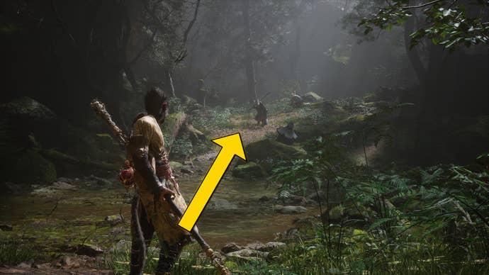 The player in Black Myth: Wukong travels along a path through the Forest Of Wolves in Chapter 1. A yellow arrow points towards the location of the waterfall hiding a secret boss.