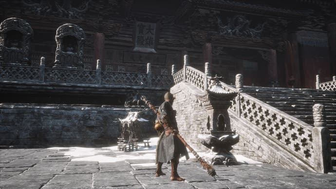 Destined in front of a shrine looking at a temple room
