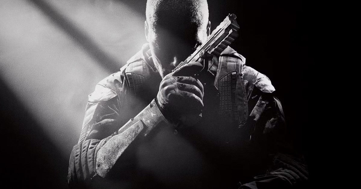 A soldier sits in the darkness, holding a pistol near their face as if resting their head on it, and thinking. A shaft of light illuminates the scene.