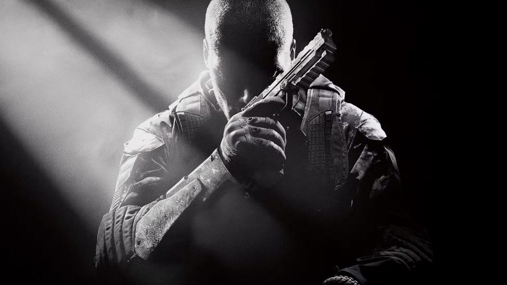 A soldier sits in the darkness, holding a pistol near their face as if resting their head on it, and thinking. A shaft of light illuminates the scene.