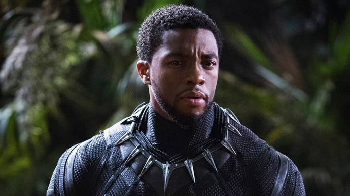 Chadwick Boseman as Black Panther without his mask on, he looks concerned about something.