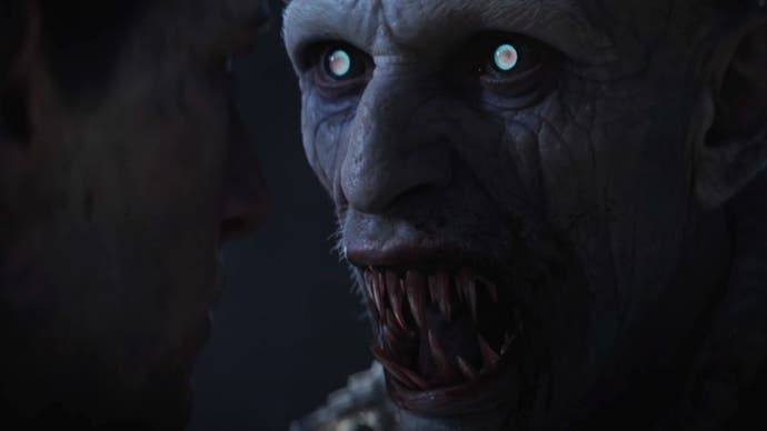 A shot from The Blood of Dawnwalker's cinematic trailer showing a close-up of a snarling vampire with glowing white eyes and a mouthful of long, bloodied teeth.