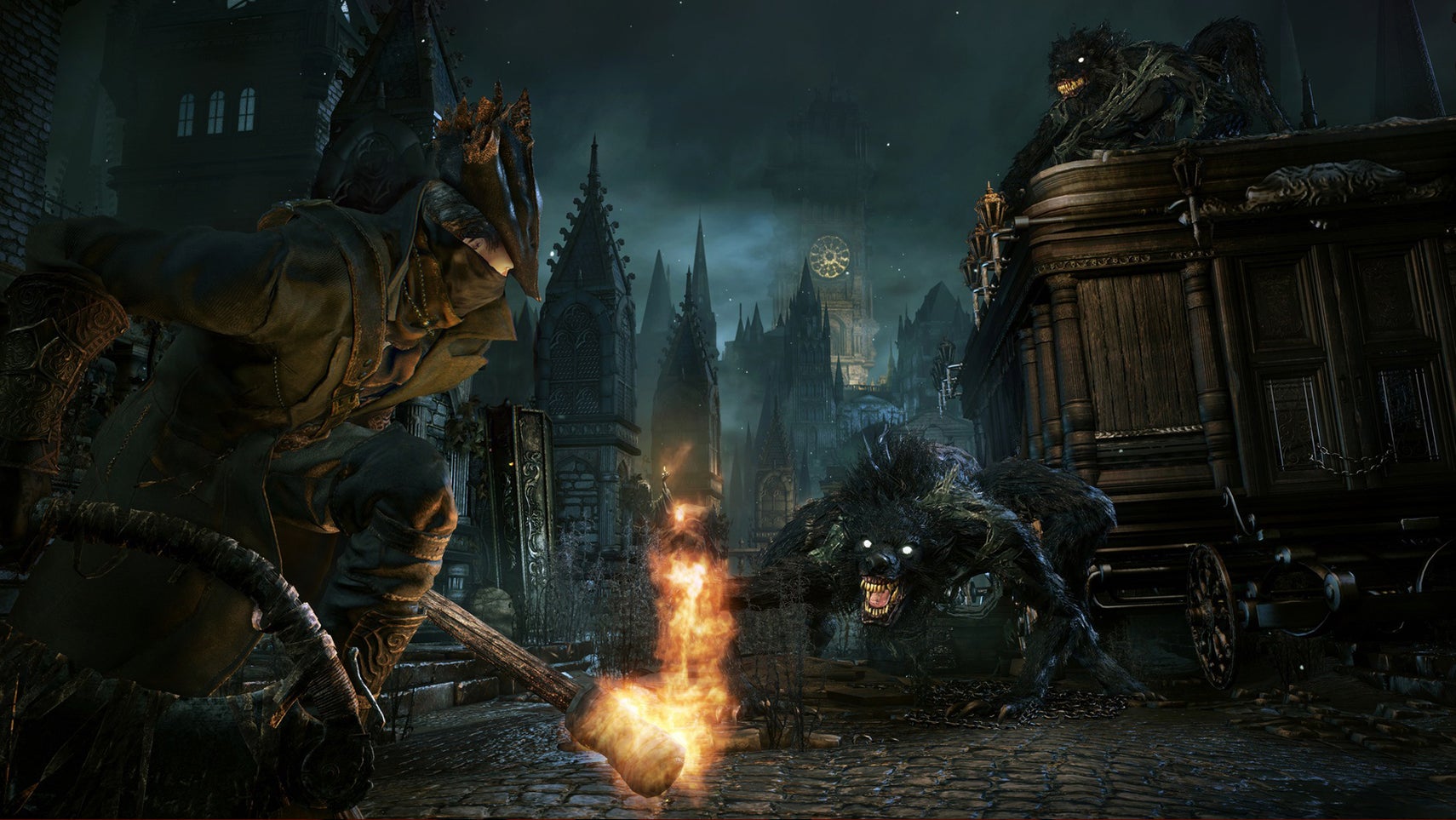 The player hunter in Bloodborne crouched with a torch, a werewolf-like creature stalking them nearby in Bloodborne. - 1