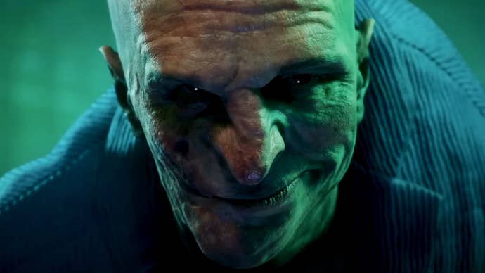 An image from Bloodlines 2’s announcement trailer showing a dark-eyed vampire smiling malevolently into the camera.