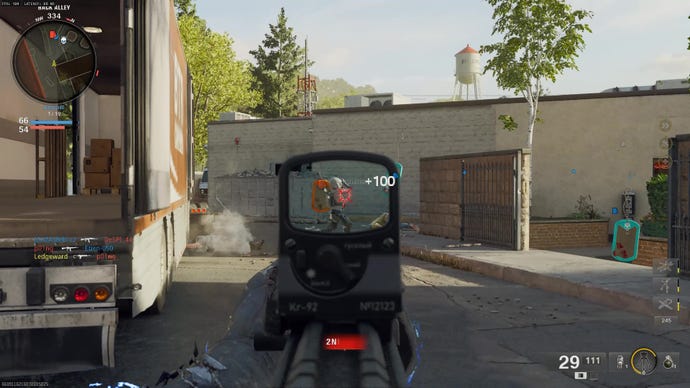 Shooting an enemy near a large lorry.