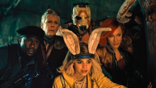 The cast of the Borderlands movie all huddled together looking at something offscreen.