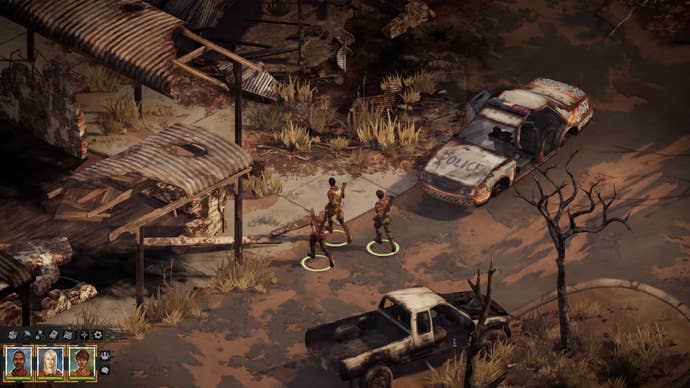 Three party members walk past a wrecked police car in the Australian wasteland of Broken Roads