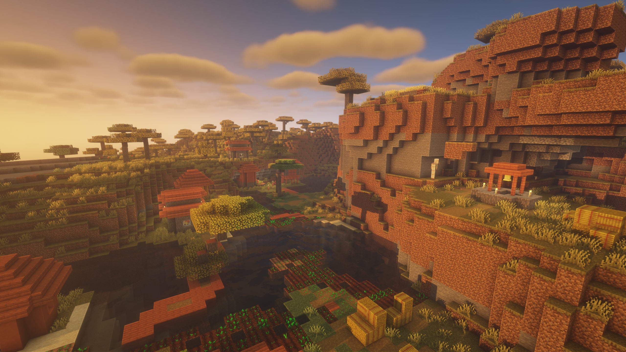 A Minecraft village on a cliffside showcasing BSL Shaders.