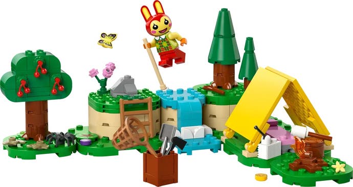 Lego version of Bunnie pole vaulting across a river. A tent it set up on a lower section of ground with a marshmallow roasting over a fire. A box of tools is set aside