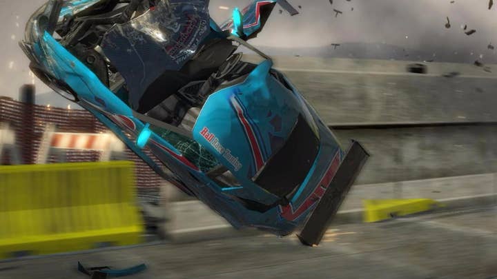 Burnout Paradise screenshot showing a destroyed car flying through the air sideways, its hood and various pieces torn off and crumbled