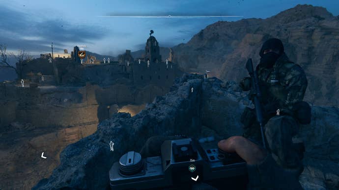 The player equips a camera to examine distant enemies in the Iraqi desert.